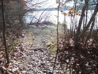 opening in trail to view of Cleveland Pond at ames nowell