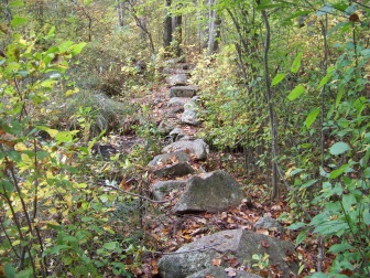 trail leading over rock wall at ames nowell state park
