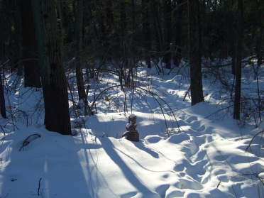 rock sculpture in snow on blue loop trail