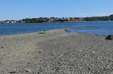 kayak pulled up on the beach at bumpkin island