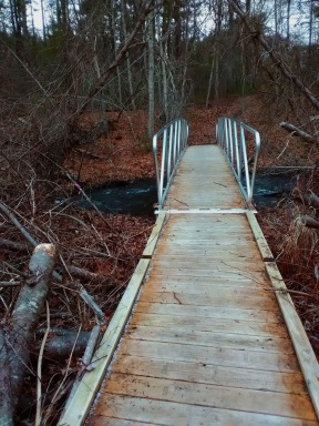 Boardwalk and bridge over Jones River at the Cranberry Watershed Preserve.