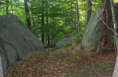 The hiking trail loop passes through these two boulders at George Ingram Park.