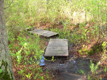 travel over wet area on john sherman path