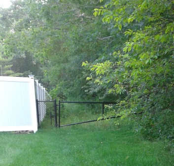 A gated entrance to an easement leading to misty meadow conservation