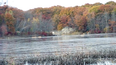 view of dam in distance at pond meadow park