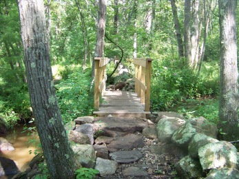 stone work leading up to a bridge crossing French stream in Rockland Town Forest