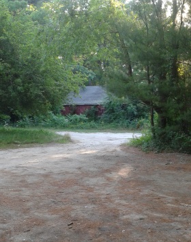 red barn at side of parking area at silver lake sanctuary