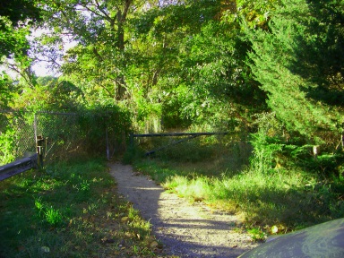 The trail entrance to Wompatuck State Park at the Aaron Reservoir.