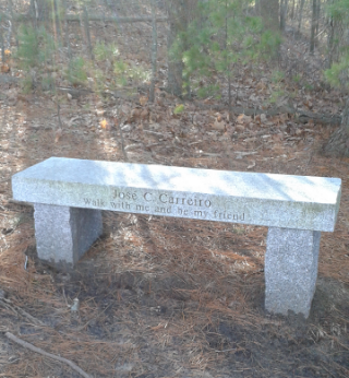 granite bench dedicated to Jose Carreira at two mile farm reservation in marshfield